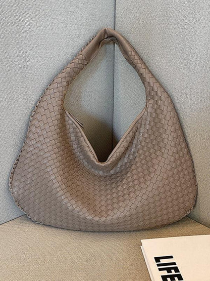 French high-end woven bag, versatile shoulder armpit bag, niche texture portable commuter bag Grey FREESIZE